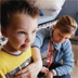 Photo of a nurse listening to a boy's chest with a stethoscope.