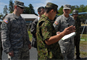 The Japan Ground Self-Defense Force staff briefs Lt. Col. James C. Horton Jr., the deputy commander of the Japan Engineer District, and Capt. Thomas Douglas, JED