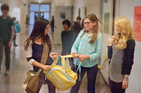 A student being bullied while others helplessly watch