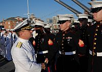 Adm. Bill Gortney, commander of U.S. Fleet Forces Command, speaks with Marines before the commencement of the 237th U.S. Navy birthday celebration.