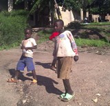 Two Kids Outside. A Village Life in Rwanda