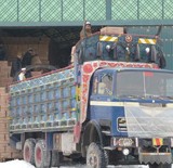 A Festive Truck is Loaded with Boxes of Tea, Cooking Oil, and Other Products at the Distribution Center of an Afghan Company that is Looking to Expand