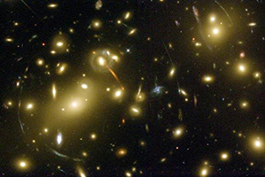 Gravitational lensing, or the warping of light around massive objects is one sign of dark energy