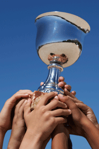 an award being held by many hands