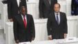 French President Francois Hollande and DRC President Joseph Kabila stand during the opening session of the Francophone Summit, in Kinshasa, DRC, Oct. 13, 2012. 