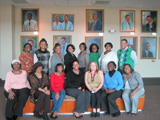 Fifteen Atlanta Champions pose together, seated and standing.