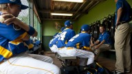 Europe's team manager Eric Vincent talks to his players before the start of their first game.