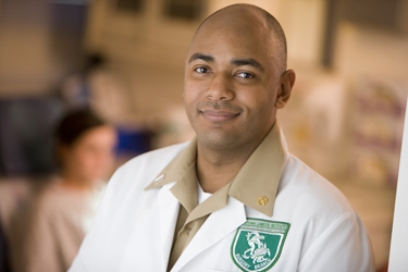 United States Public Health Service Commissioned Corps nurse with a patient