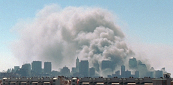 Smoke rises from the site of the World Trade Center, September 11, 2001.