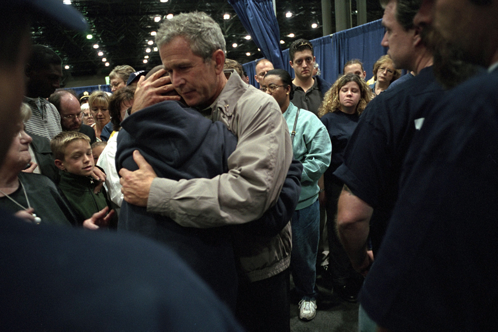 President George W. Bush consoles families of victims of the World Trade Center disaster during a visit to New York City, September 14, 2001. (7384-09)