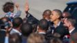 President Barack Obama high-fives with a child as he arrives at the Newport News/Williamsburg International Airport in Newport News, Va. October 13, 2012.