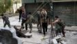 Members of the Free Syrian Army use a catapult to launch a homemade bomb during clashes with pro-government soldiers in the city of Aleppo, October 15, 2012. 