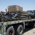 An Afghan contractor checks scrap metal and boxes loaded on back up a contracted "jingle" truck at Todd Maritime Services International, a coalition-contracted shipping and receiving yard in Kabul in July, 2012. The metal and other coalition equipment was collected and sold with the help of the Defense Reutilization and Marketing Office. The Deputy Command of Support Operations under NATO Training Mission-Afghanistan and within DCOM-SPO, Regional Support Command-Capital worked very closely with DRMO on the project in hopes of showing our Afghan partners how to obtain funds from old equipment and scrap  materials. (Photo by USMC Capt. Matthew P. Beuchert)