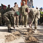 Gen. Sher Mohammad Karimi, Chief of General Staff for the ANA, and Lt. Gen. Adrian J. Bradshaw, Deputy Commander ISAF, dig the first holes ground breaking ceremony for the Afghanistan National Army Officers Academy, 11 Oct. Photo by MC3 (SW) Sean Weir, NTM-A Public Affairs.