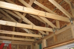 Planning carefully for insulation results in reduced utility bills and superior comfort during the life of the home. In this house, raised heel trusses accommodate R-60 insulation. | Credit: Paul Norton, NREL.
