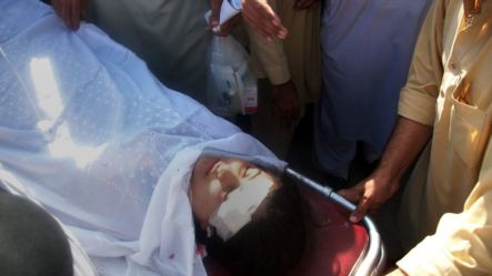 Pakistani hospital workers carry injured Malala Yousafzai, 14, on a stretcher at a hospital following an attack by gunmen in Mingora on October 9, 2012.