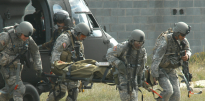Soldiers unload a simulated casualty from a UH-60 Blackhawk