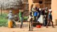 Children gather water in Bagega, Nigeria, where thousands have been exposed to lead poisoning.  Doctors say until the village is cleaned up, they can't test or treat the children. (H. Murdock for VOA)