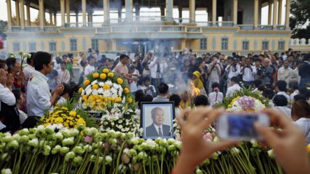 A woman mourns the death of former King Norodom Sihanouk at the Royal Palace in Phnom Penh, Cambodia,  October 16, 2012.