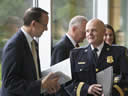 Participants mingle before hearing Attorney General Eric Holder discuss efforts to battle Intellectual Property theft at Towson University.