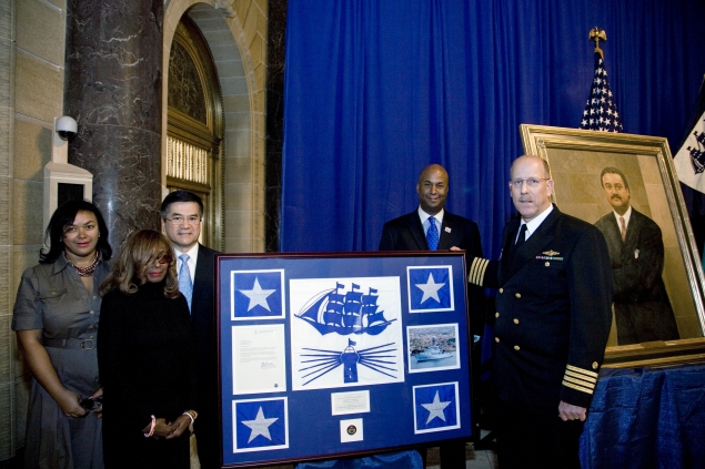 The Brown family joins Secretary Locke for a presentation of the NOAA flag that was flown aboard the NOAA ship Ronald H. Brown.