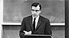  dr gordon iseminger teaches a class in a black and white photo from 1969