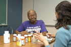 A man talking with a health care provider about medications - Click to enlarge in new window.