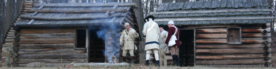 Reenactors maintaining soldier huts in Jockey Hollow