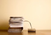 Stack of papers connected to a hard drive, Going Paperless, Technology, Paperwork Reduction