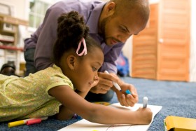 Father working with daughter