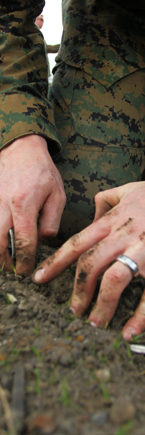 A Marine prepares explosive materials for a controlled detonation