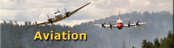 Lead plane Bravo 7 leads an airtanker  retardant drop. Photo by Kari Greer