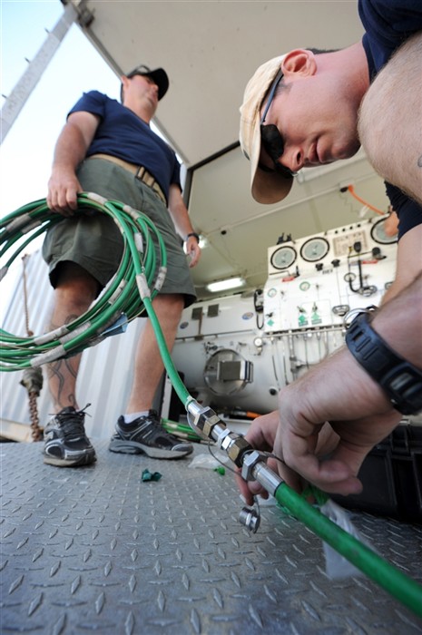 ROTA, Spain (July 9, 2011) - Navy Divers 1st Class Jason Young and Mike Gilbert, attached to Mobile Diving and Salvage Unit (MDSU) 2, work to prepare oxygen hoses aboard the Military Sealift Command rescue and salvage ship USNS Grasp (T-ARS 51). Grasp, MDSU-2 and Navy archeologists, scientists, and historians are currently preparing to deploy to the North Sea, to conduct diving expeditions and verify sites of suspected shipwrecks. (U.S. Navy Photo by Mass Communication Specialist 1st
Class Ja&#39;lon A. Rhinehart/RELEASED)