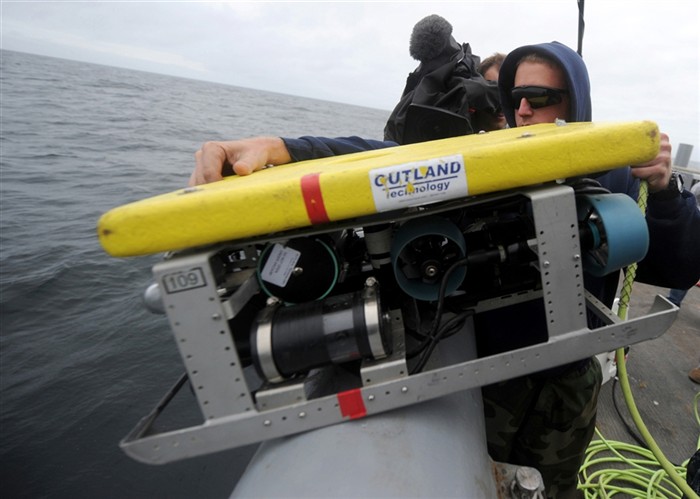 NORTH SEA (July 26, 2011) - Sonar Technician (Surface) 2nd Class Dave Meyers, assigned with the area search platoon of Mobile Diving and Salvage Unit (MDSU) 2, prepares to launch a remote operated vehicle from aboard the Military Sealift Command rescue and salvage ship USNS Grasp (T-ARS 51). MDSU-2 and Navy archeologists, scientists, and historians are in the North Sea conducting diving operations verifying the sites of suspected shipwrecks. The researchers hope to find USS Bonhomme Richard, the historic ship commanded by John Paul Jones. (U.S. Navy Photo by Mass Communication Specialist 1st Class Ja&#39;lon A. Rhinehart/RELEASED)