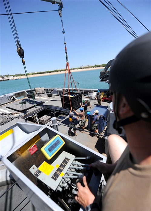 ROTA, Spain (July 7, 2011) - U.S. Navy Divers, stationed with Mobile Diving and Salvage Unit (MDSU) 2, move equipment during a gear onload aboard the Military Sealift Command rescue and salvage ship USNS Grasp (T-ARS 51). Grasp, MDSU-2 and Navy archeologists, scientists, and historians are currently preparing to deploy to the North Sea, to conduct diving expeditions and verify sites of suspected shipwrecks. (U.S. Navy Photo by Mass Communication Specialist 1st Class Ja&#39;lon A. Rhinehart/UNRELEASED)