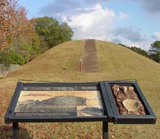(photo) Interpretive signage in front of a mound at Ocmulgee National Monument. (NPS)
