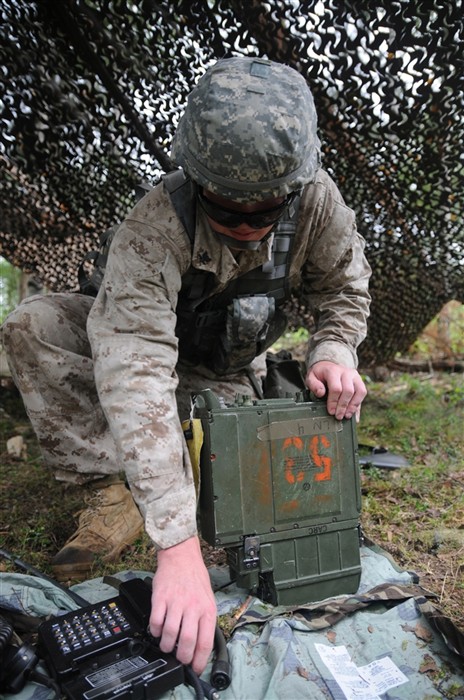 Petty Officer 3rd Class Toby League, Naval Support Activity Naples, Italy, a candidate for the 2011 U.S. Army Europe Expert Field Medical Badge Standardization and Testing, calls for an evacuation of casualties as part of Combat Testing Lane 3 Aug. 3, 2011 at the Grafenwoehr Training Area, Germany.
League is one of a handful of joint and multinational service members working toward the U.S. Army medical community&#39;s most prestigious professional badge. (U.S. Army photo by Spc. Trisha Pinczes)