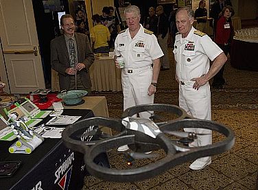 Chief of Naval Operations (CNO) Adm. Gary Roughead, left, and Rear Adm. Nevin Carr, Chief of Naval Research, observe a commercially available drone while touring the exhibit portion of the Office of Naval Research-hosted Naval Science, Technology, Engineering and Mathematics (STEM) Forum. The drone is just one example used by the Space Warfare Systems Command (SPAWAR) to teach how technology is used in the real world.  U.S. Navy photo by John F. Williams (Released)  110616-N-PO203-113