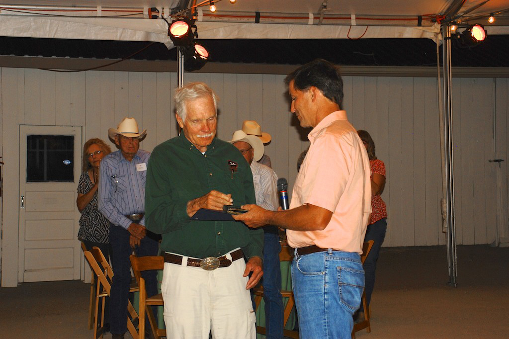  Service Director Dan Ashe presents Recovery Champion Award to Ted Turner.
Photo Credit: Rich Lowell