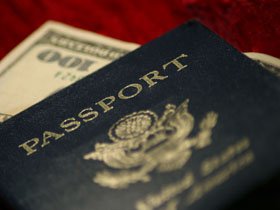 image of a passport and money