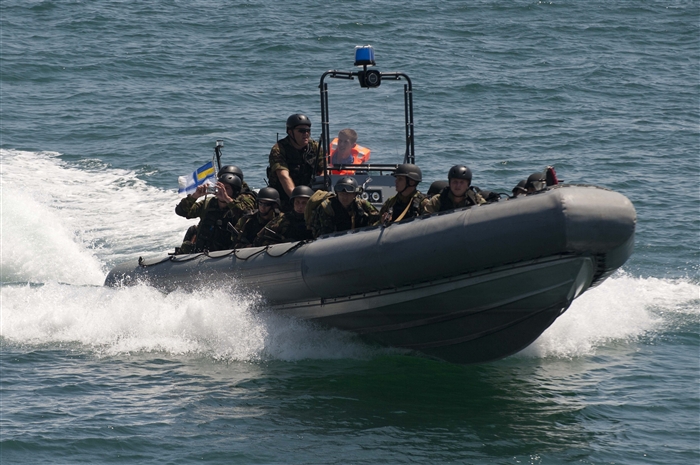 BLACK SEA - Ukrainian navy boarding team members approach the guided-missile destroyer USS Jason Dunham (DDG 109) for a boarding exercise during the at-sea portion of Exercise Sea Breeze 2012 (SB12). SB12, co hosted by the Ukrainian and U.S. navies, aims to improve maritime safety, security and stability engagements in the Black Sea by enhancing the capabilities of Partnership for Peace and Black Sea regional maritime security forces. 