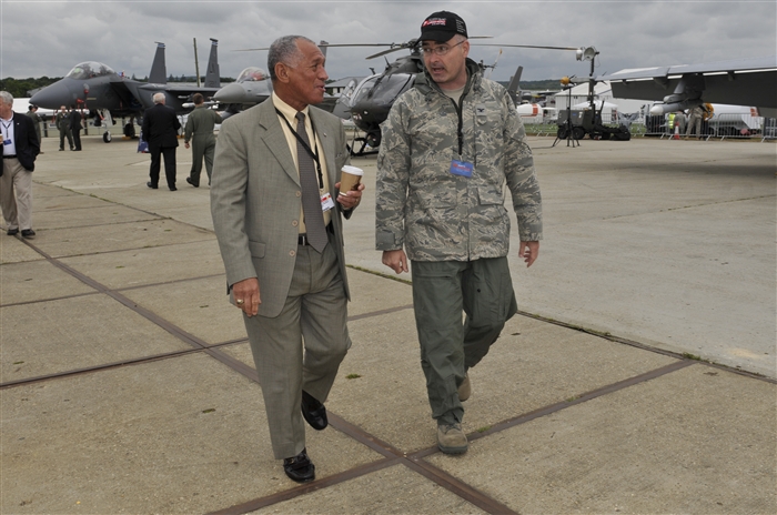 U.S. Air Force Col. George Uribe, United States Air Forces in Europe air boss talks with Charles Bolden National Aeronautics and Space Administration administrator July 10, 2012, during the Farnborough International Air Show in Farnborough, England. Approximately 90 aircrew and support personnel from bases in Europe and the United States are participating in the air show. Participation in this premier event demonstrates that U.S. defense industry offers state-of-the-art capabilities vital for the support and protection of our allies’ and partners’ national-security interests.