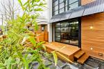 The awnings on this home shade the windows and generate electricity. | Photo courtesy of ©iStockphoto/jhorrocks
