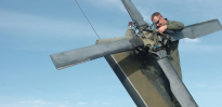 aviation mechanic working on rotor blades