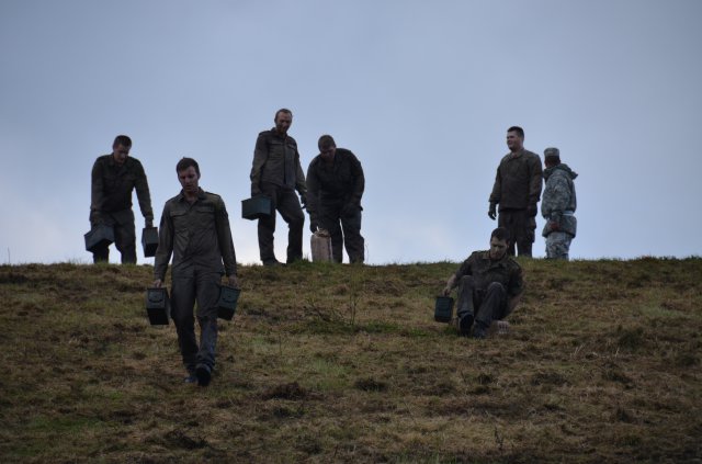 Soldiers from the 467 Logistic Battalion and German Reserve unit from Oberfranken West make their way down the Mountain of Despair carrying two ammo cans or a five-gallon water jugs,Sept. 28, 2012, on Warner Barracks near Bamberg, Germany. The Mountain of Despair proved to be the most dreaded and challenging obstacle competitors faced.