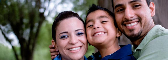 Portrait of smiling parents with young son