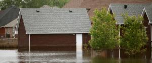 Flood waters rising in a neighborhood of houses