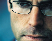 Close up of a man wearing glasses