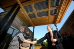 On Friday, Sept. 30, 2011, U.S. Department of Energy Secretary Steven Chu spoke with Jeffrey Tiller, left, and David Lee, right, members of Appalachian State’s Solar Decathlon team. | Credit: Stefano Paltera/U.S. Department of Energy Solar Decathlon