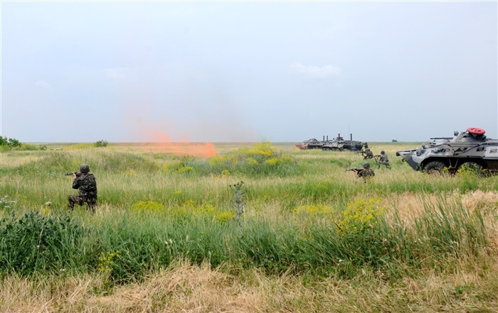 SHIROKILAN, Ukraine (June 11, 2011) - Multinational marines provide support during an improvised explosive device training evolution during a joint land component demonstration as part of exercise Sea Breeze 2011. Air, land and naval forces from Azerbaijan, Algeria, Belgium, Denmark, Georgia, Germany, Macedonia, Moldova, Sweden, Turkey, Ukraine, the United Kingdom and the United States are participating in Sea Breeze, the largest multinational maritime exercise this year in the Black Sea, June 6-18, and is co-hosted by the Ukrainian and U.S. Navies. (U.S. Navy photo by Mass Communication Specialist 3rd Class Caitlin Conroy/RELEASED)